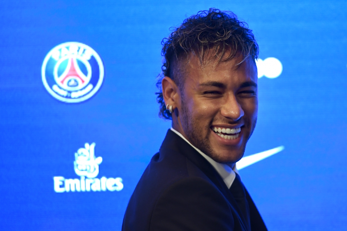 (FILES) This file photo taken on July 22, 2017 at the Red Bull Arena in Harrison shows Barcelona's Brazilian forward Neymar smiling during a training session.
Neymar is expected to arrive in Paris on August 3, 2017 to finalise his world record 222 million euro ($260 million) move from Barcelona to Paris Saint-Germain, which will earn him around 30 million euros ($35.5 million) a year. / AFP PHOTO / Jewel SAMAD