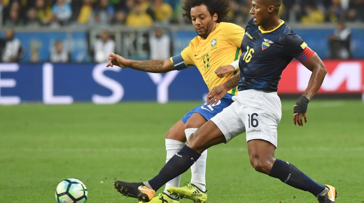 Brazil's Marcelo and Ecuador's Antonio Valencia vie for the ball during their 2018 World Cup qualifier football match in Porto Alegre, Brazil, on August 31, 2017. / AFP PHOTO / NELSON ALMEIDA -  AFP PHOTO