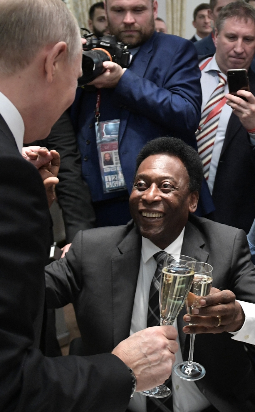 A picture shows a general view with the groups displayed on screens after   the Final Draw for the 2018 FIFA World Cup football tournament at the State Kremlin Palace in Moscow on December 1, 2017.
The 2018 FIFA World Cup will be held from June 14 and July 15, 2018, in 11 Russian cities. / AFP PHOTO / Mladen ANTONOV