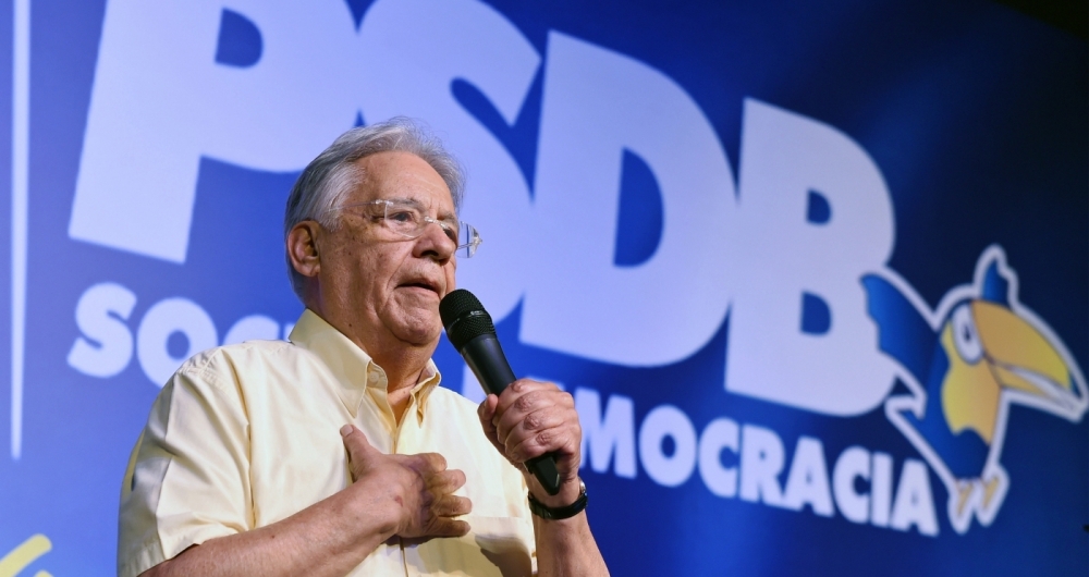 Former Brazilian President Fernando Henrique Cardoso delivers a speech during national convention of the Brazilian Social Democratic Party (PSDB), in Brasilia, on December 9, 2017.
The PSDB convention overwhelmingly elected Alckmin as its leader -- voting 470 to three -- effectively launching him as the party's candidate for the October 2018 polls. / AFP PHOTO / EVARISTO SA
      Caption