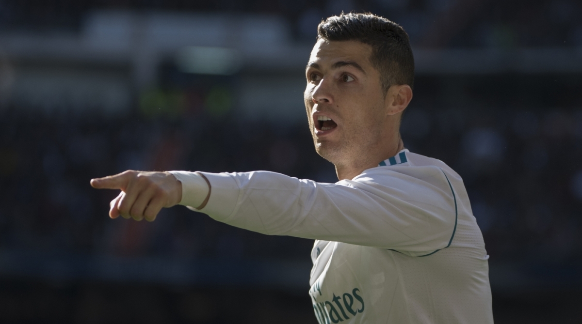 Real Madrid's Portuguese forward Cristiano Ronaldo gestures during the Spanish League "Clasico" football match Real Madrid CF vs FC Barcelona at the Santiago Bernabeu stadium in Madrid on December 23, 2017.  / AFP PHOTO / CURTO DE LA TORRE