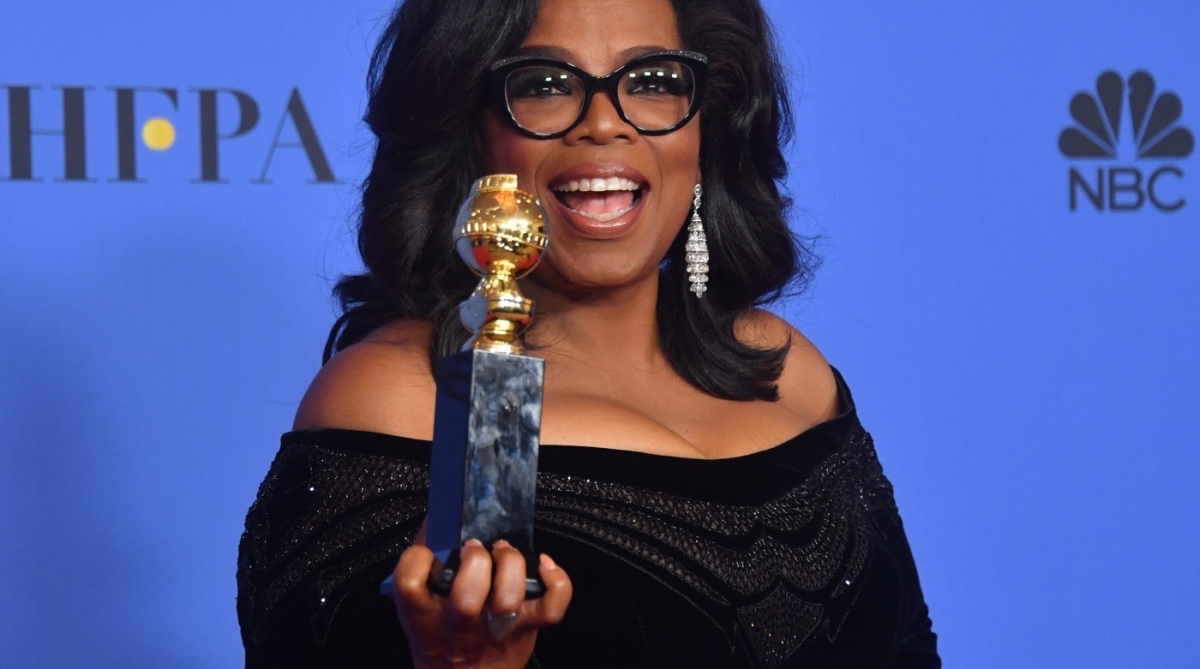 Actress and TV talk show host Oprah Winfrey poses with the Cecil B. DeMille Award during the 75th Golden Globe Awards on January 7, 2018, in Beverly Hills, California. / AFP PHOTO / Frederic J. BROWN