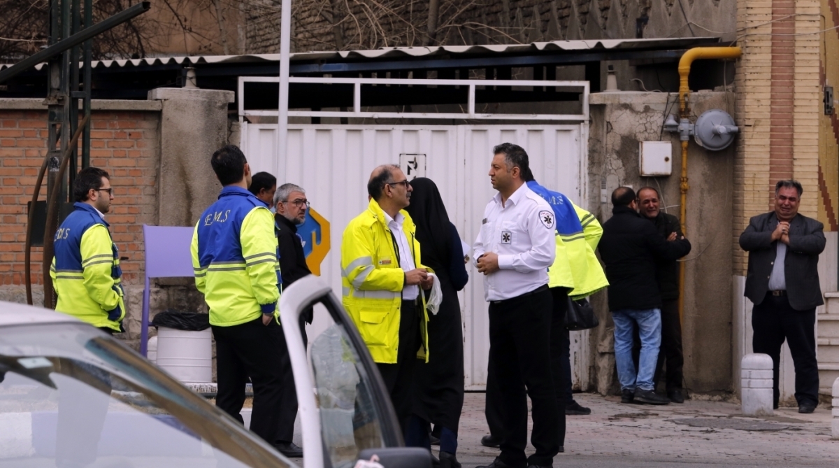 Relatives of Iranian passengers, onboard the Aseman Airlines flight EP3704, react as they gather in front of a mosque near Tehran's Mehrabad airport on February 18, 2018. 
All 66 people on board an Iranian passenger plane were feared dead after it crashed into the country's Zagros mountains, with emergency services struggling to locate the wreckage in blizzard conditions.  / AFP PHOTO / ATTA KENARE
      Caption
