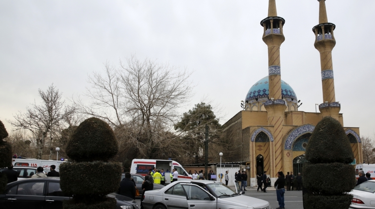 Relatives of Iranian passengers, onboard the Aseman Airlines flight EP3704, react as they gather in front of a mosque near Tehran's Mehrabad airport on February 18, 2018. 
All 66 people on board an Iranian passenger plane were feared dead after it crashed into the country's Zagros mountains, with emergency services struggling to locate the wreckage in blizzard conditions.  / AFP PHOTO / ATTA KENARE
      Caption