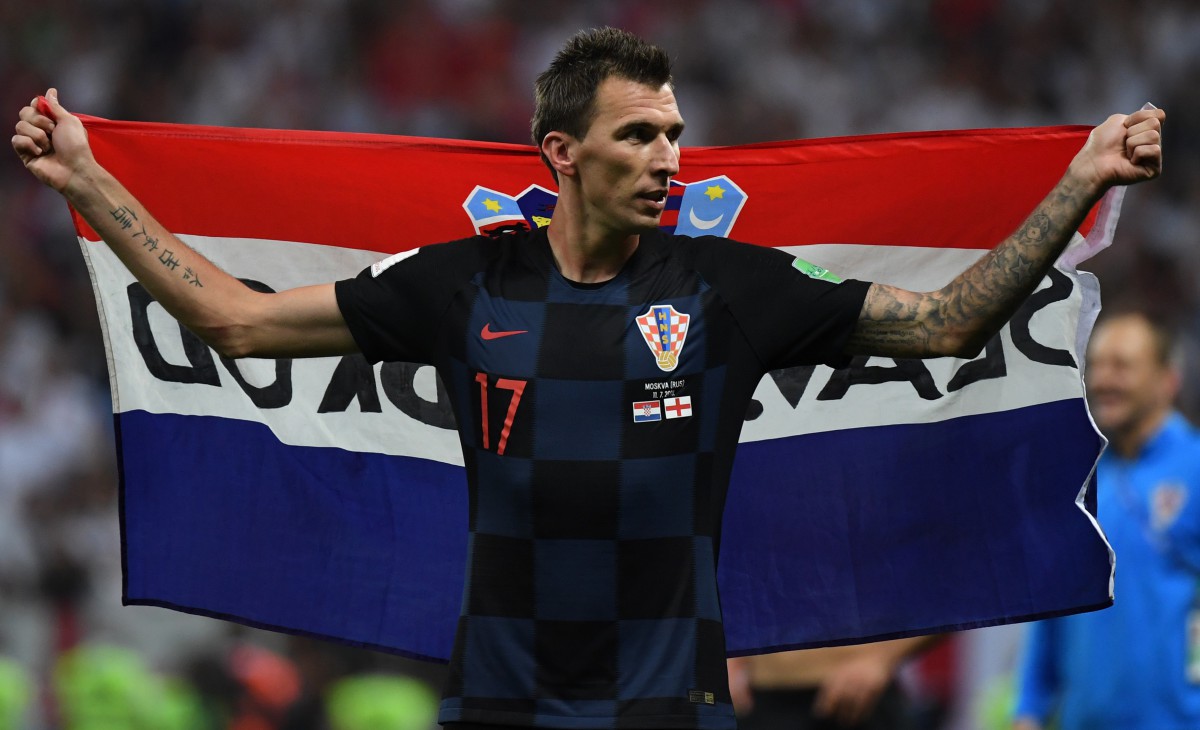 Croatia's forward Mario Mandzukic celebrates at the end of the Russia 2018 World Cup semi-final football match between Croatia and England at the Luzhniki Stadium in Moscow on July 11, 2018. / AFP PHOTO / YURI CORTEZ / RESTRICTED TO EDITORIAL USE - NO MOBILE PUSH ALERTS/DOWNLOADS - AFP