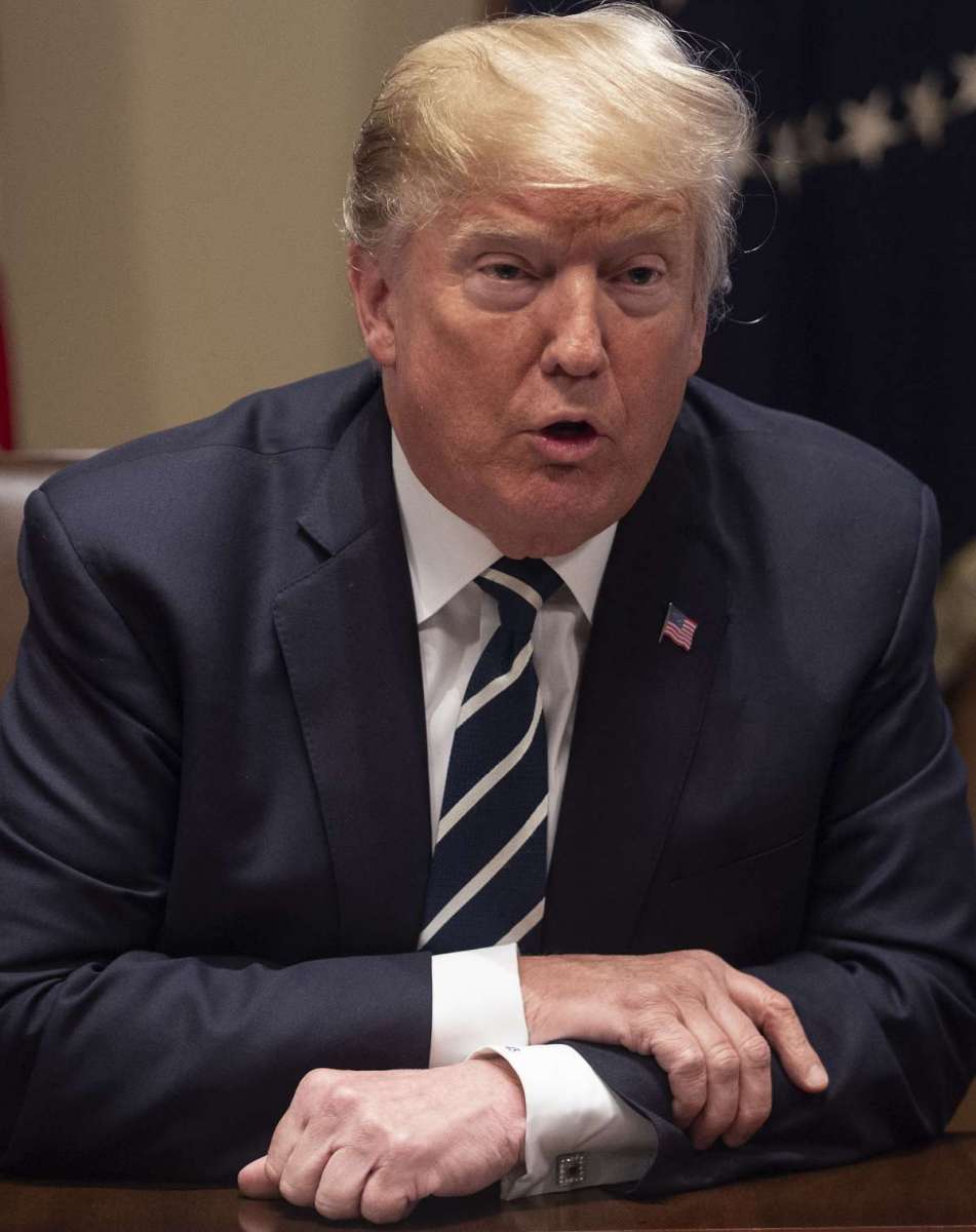 US President Donald Trump speaks about his meeting with Russian President Vladimir Putin ahead of a meeting with Republican lawmakers and cabinet members on tax cuts at the White House in Washington, DC, on July 17, 2018. / AFP PHOTO / NICHOLAS KAMM
      Caption