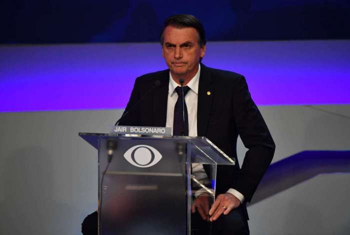 Brazilian presidential candidate Jair Bolsonaro (PSL), speaks during the first presidential debate ahead of the October 7 general election, at Bandeirantes television network in Sao Paulo, Brazil, on August 9, 2018. / AFP PHOTO / Nelson ALMEIDA
