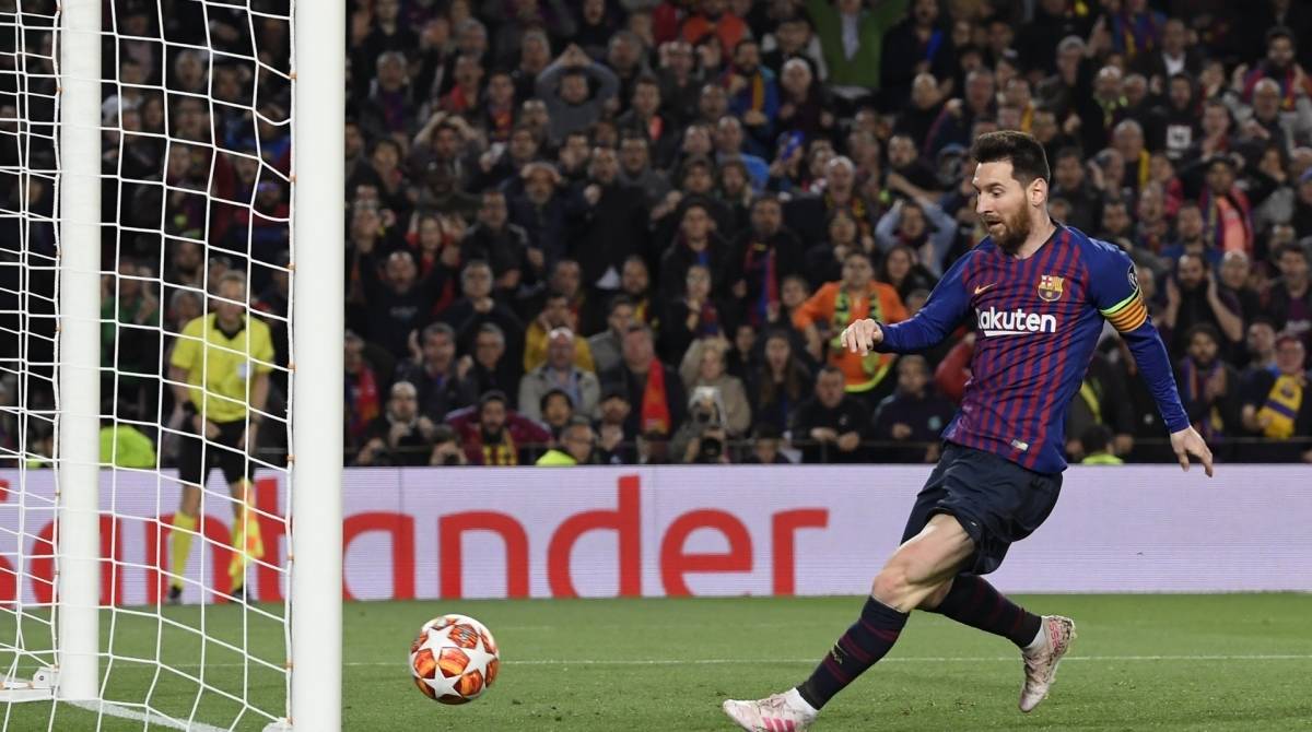 Barcelona's Argentinian forward Lionel Messi scores a goal during the UEFA Champions League semi-final first leg football match between Barcelona and Liverpool at the Camp Nou Stadium in Barcelona on May 1, 2019. (Photo by LLUIS GENE / AFP)