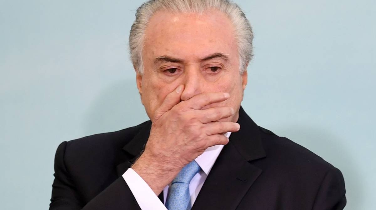 (FILES) In this file photo taken on June 07, 2017 Brazilian President Michel Temer gestures as he attends a ceremony to launch the Agricultural and Livestock Plan 2017/2018 at Planalto Palace in Brasilia, Brazil. - An appeals court in Rio de Janeiro decided on May 8, 2019 that former Brazilian President Michel Temer, who faces accusations of corruption, must return to jail and the decision "has immediate effect," a court adviser confirmed to AFP. Temer had been provisionally imprisoned at the end of March but released a few days later by order of an appeals judge, whose decision was reverted today. (Photo by EVARISTO SA / AFP)