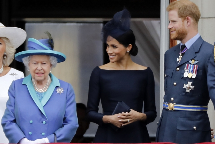 Na foto de 10 de julho de 2018, a rainha Elizabeth II da Grã-Bretanha, Meghan, o príncipe Harry da Grã-Bretanha, na varanda do Palácio de Buckingham, em Londres - AFP