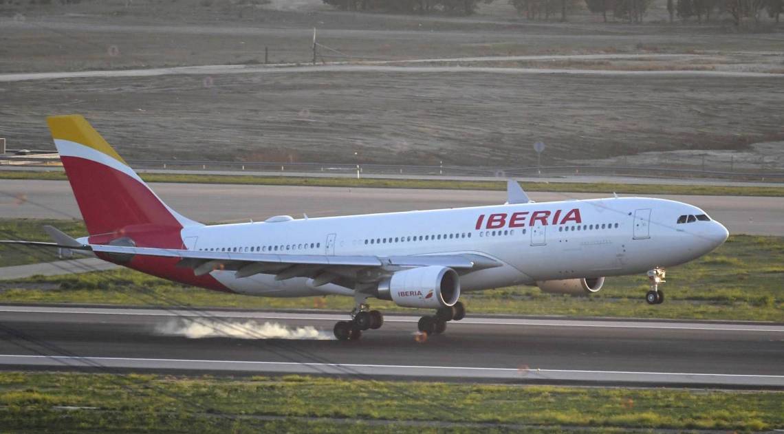 A plane by Spain's flagship carrier Iberia lands at Madrid-Barajas Adolfo Suarez Airport on February 03, 2020 in Madrid. - An Air Canada flight was due to make an emergency landing in Madrid following a technical problem just hours after taking off from the city's Barajas airport, aviation officials said. (Photo by JAVIER SORIANO / AFP)