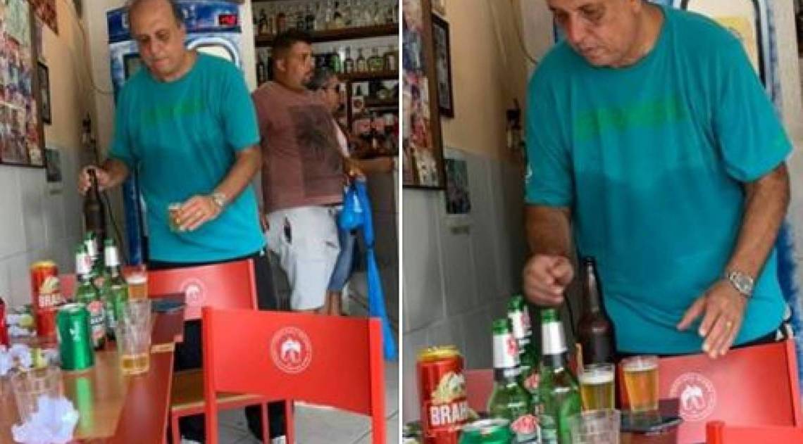Solto e cumprimento medidas cautelares por ser réu na Lava Jato, Pezão bebe e come torresmo em bar de Piraí, sua cidade natal