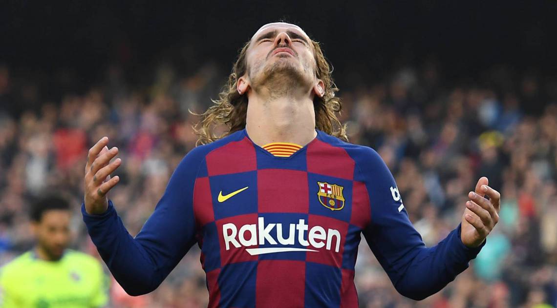 Barcelona's French forward Antoine Griezmann reacts after missing a goal opportunity  during the Spanish league football match between FC Barcelona and Getafe CF at the Camp Nou stadium in Barcelona on February 15, 2020. (Photo by Josep LAGO / AFP)