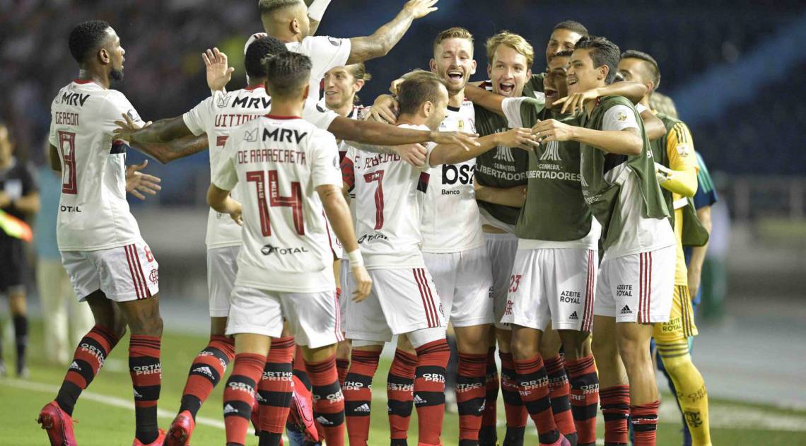 Brazil's Flamengo players celebrate after scoring a goal against Colombia's Junior de Barranquilla during their Copa Libertadores football match at Metropolitano Roberto Melendez Stadium, in Barranquilla, Colombia, on March 4, 2020. (Photo by Raul ARBOLEDA / AFP)