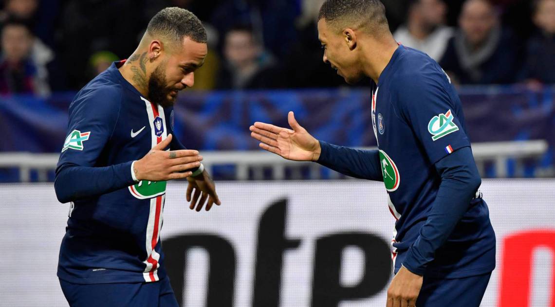 Paris Saint-Germain's French forward Kylian Mbappe (R) is congratulated by Paris Saint-Germain's Brazilian forward Neymar after scoring a goal during the French Cup semi-final football match between Olympique Lyonnais (OL) and Paris Saint-Germain (PSG) at the Groupama Stadium in Decines-Charpieu, centraleastern France, on March 4, 2020. (Photo by Philippe DESMAZES / AFP)