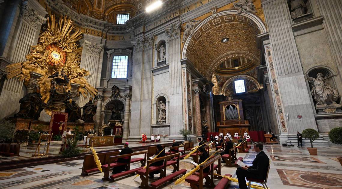 Pope Francis gathers his thoughts while holding a palm branch as he celebrates Palm Sunday mass behind closed doors at St. Peter's Basilica on April 5, 2020 in The Vatican, during the lockdown aimed at curbing the spread of the COVID-19 infection, caused by the novel coronavirus.
 - AFP