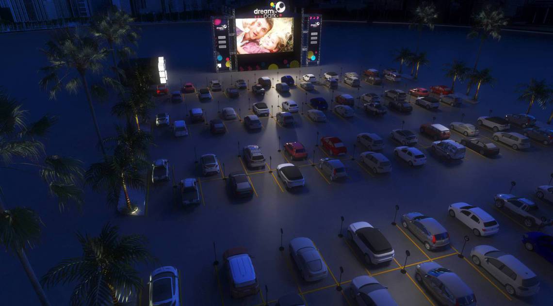 Arte do Dream Park com visão aérea do estacionamento com carros intercalados 