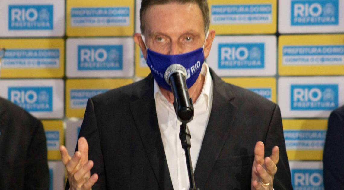 RJ - COLETIVA DO PREFEITO, MARCELO CRIVELLA - POLÍTICA - O prefeito do Rio de Janeiro, Marcelo Crivella, fala a imprensa sobre a nova fase de retomada das atividades na cidade, no Pavilhão 1 do Riocentro, nesta sexta-feira, 26.
Foto: FERNANDO SALLES/AM PRESS & IMAGES/ESTADÃO CONTEÚDO