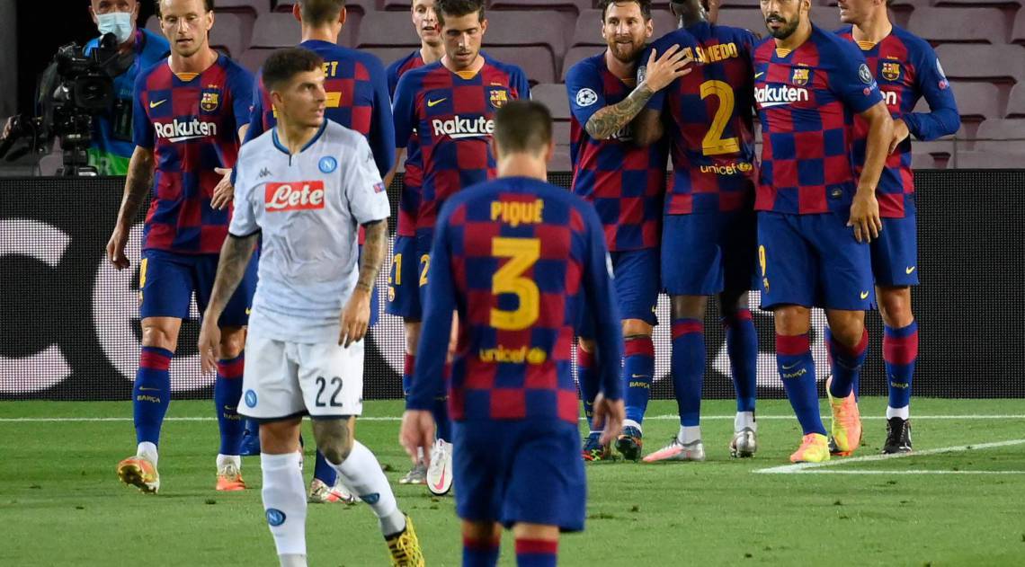 Barcelona's Argentine forward Lionel Messi (C) celebratres after scoring the third goal that will be disallowed due to a handball during the UEFA Champions League round of 16 second leg football match between FC Barcelona and Napoli at the Camp Nou stadium in Barcelona on August 8, 2020. (Photo by LLUIS GENE / AFP)