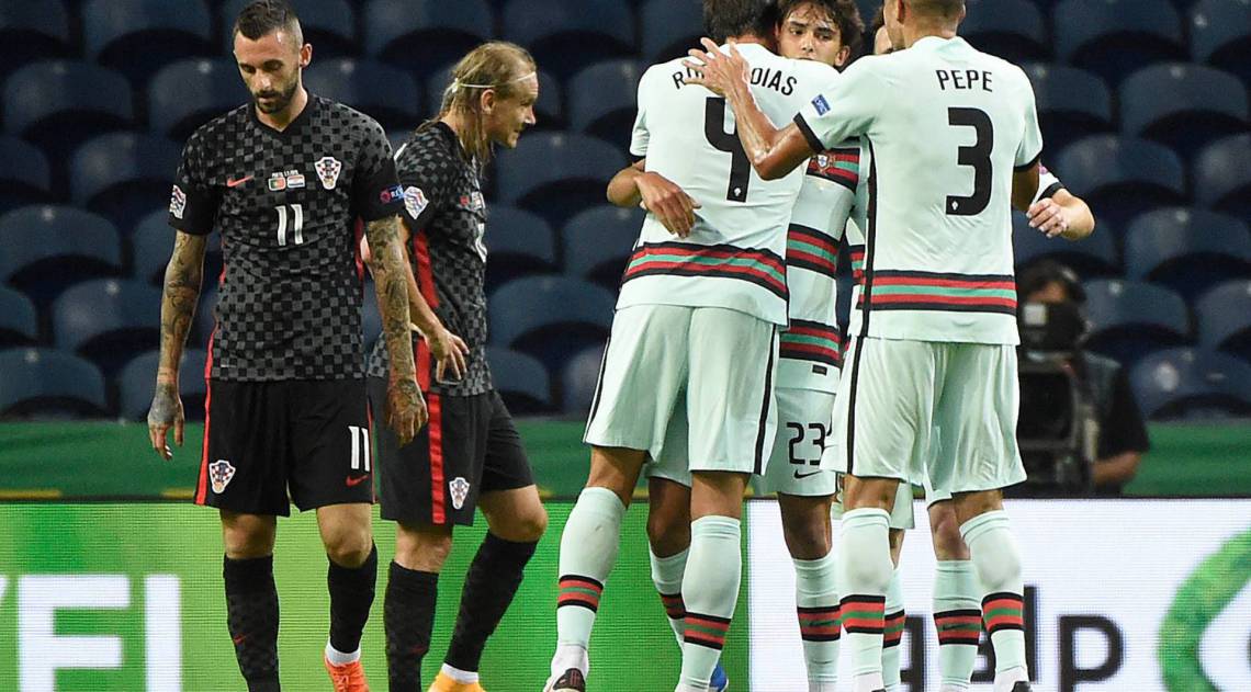 Portugal's forward Joao Felix (back 2ndR) celebrates with teammates after scoring a goal during the UEFA Nations League A group 3 football match between Portugal and Croatia at the Dragao Stadium in Porto on September 5, 2020. (Photo by MIGUEL RIOPA / AFP)
