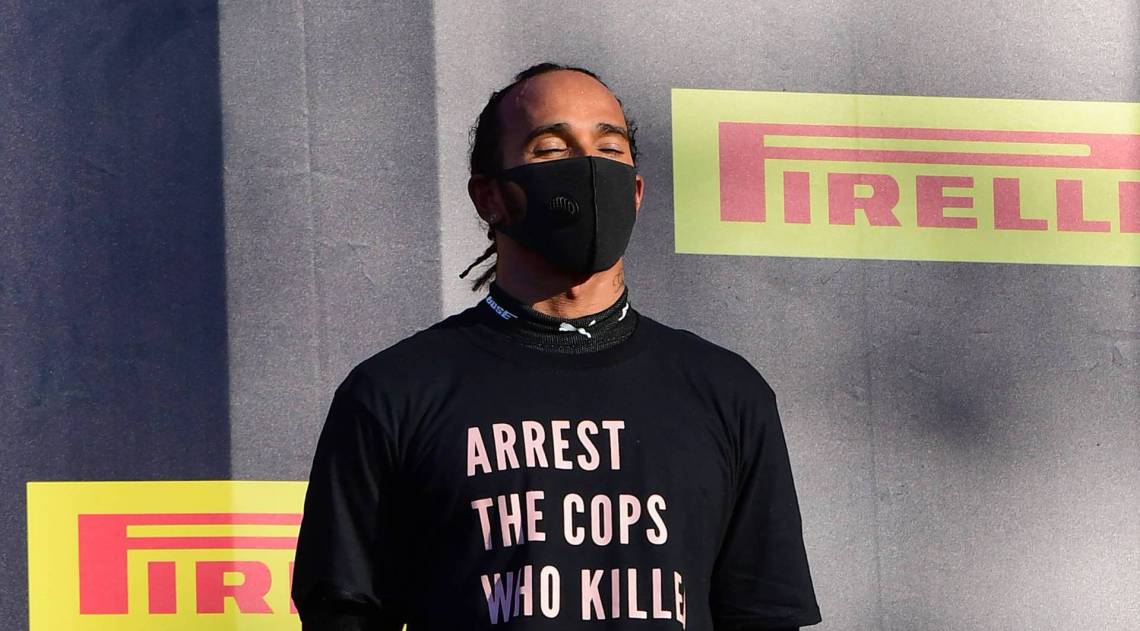Winner Mercedes' British driver Lewis Hamilton reacts on the podium after the Tuscany Formula One Grand Prix at the Mugello circuit in Scarperia e San Piero on September 13, 2020. (Photo by JENNIFER LORENZINI / various sources / AFP)