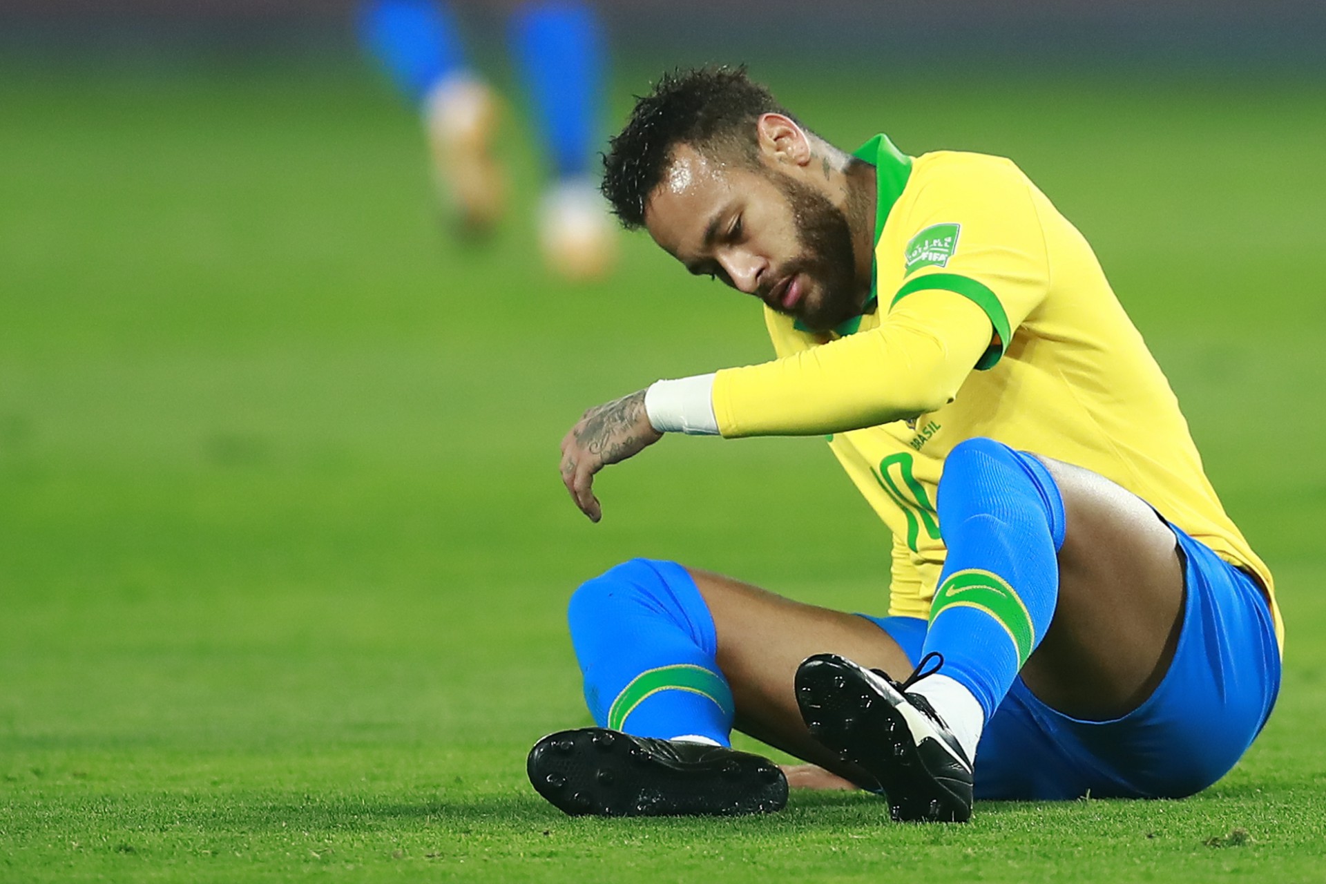 Brazil's Neymar sits on the ground during the 2022 FIFA World Cup South American qualifier football match against Peru at the National Stadium in Lima, on October 13, 2020, amid the COVID-19 novel coronavirus pandemic. (Photo by Daniel APUY / POOL / AFP) - AFP