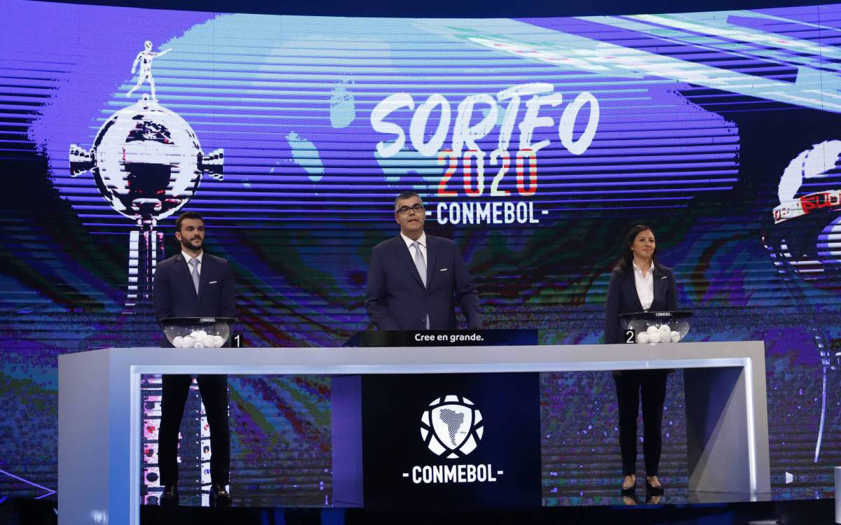 The Clubs Competitions Director of the South American Football Confederation (Conmebol), Frederico Nantes (C), delivers a speech during the draw for the next rounds of the Copa Libertadores and Copa Sudamericana football tournaments at the Conmebol headquarters in Luque, Paraguay, on October 23, 2020. (Photo by Nathalia Aguilar / POOL / AFP) - AFP