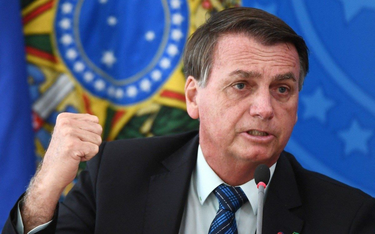 (FILES) In this file photo taken on February 05, 2021 Brazilian President Jair Bolsonaro gestures as he speaks during a press conference on a new fuel tax policy at Planalto Palace in Brasilia. - President Jair Bolsonaro on March 4, 2021 urged Brazilians to &quot;stop whining&quot; about COVID-19 and renewed his attacks on stay-at-home measures to contain the pandemic, amid a surge of cases that is pushing hospitals to the brink. (Photo by EVARISTO SA / AFP) - AFP