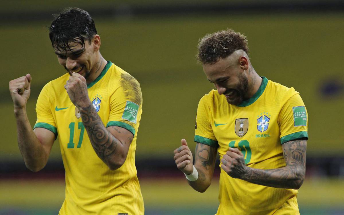 Brazil's Neymar (R) celebrates with teammate Lucas Paqueta after scoring a penalty against Ecuador during their South American qualification football match for the FIFA World Cup Qatar 2022 at the Jose Pinheiro Borda stadium, better known as Beira-Rio, in Porto Alegre, Brazil, on June 4, 2021. (Photo by SILVIO AVILA / AFP) - AFP