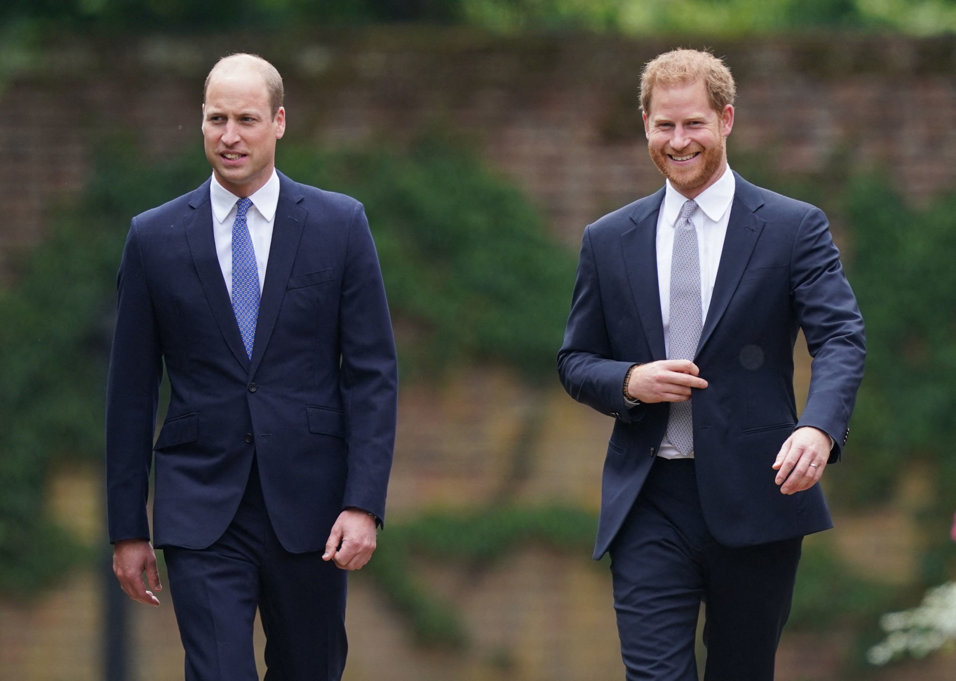 Britain's Prince William, Duke of Cambridge (L) and Britain's Prince Harry, Duke of Sussex arrive for the unveiling of a statue of their mother, Princess Diana at The Sunken Garden in Kensington Palace, London on July 1, 2021, which would have been her 60th birthday. - Princes William and Harry set aside their differences on Thursday to unveil a new statue of their mother, Princess Diana, on what would have been her 60th birthday. (Photo by Yui Mok / POOL / AFP) - AFP