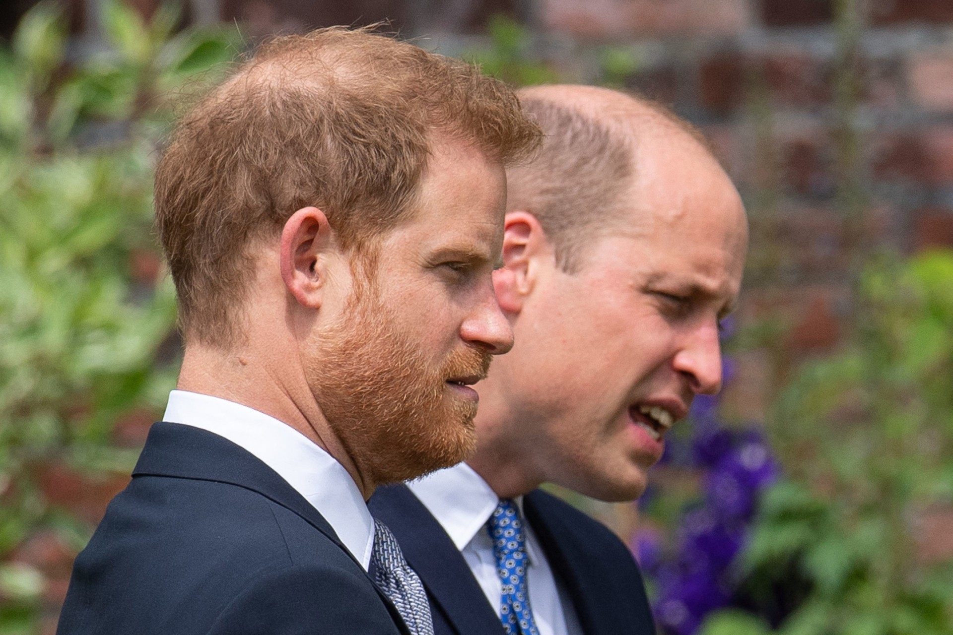 Britain's Prince William, Duke of Cambridge (R) and Britain's Prince Harry, Duke of Sussex attend the unveiling of a statue of their mother, Princess Diana at The Sunken Garden in Kensington Palace, London on July 1, 2021, which would have been her 60th birthday. - Princes William and Harry set aside their differences on Thursday to unveil a new statue of their mother, Princess Diana, on what would have been her 60th birthday. (Photo by Dominic Lipinski / POOL / AFP) - AFP
