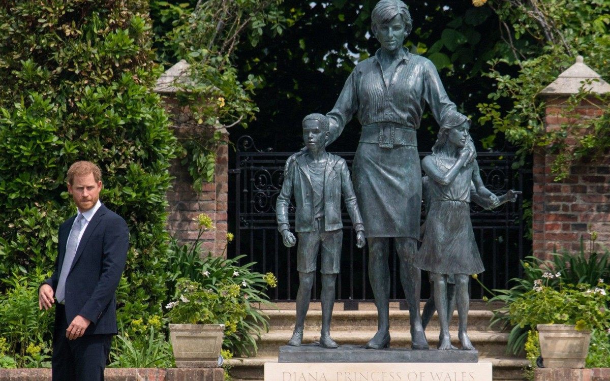 Britain's Prince Harry, Duke of Sussex gestures at the unveiling of a statue of his mother, Princess Diana at The Sunken Garden in Kensington Palace, London on July 1, 2021, which would have been her 60th birthday. - Princes William and Harry set aside their differences on Thursday to unveil a new statue of their mother, Princess Diana, on what would have been her 60th birthday. (Photo by Dominic Lipinski / POOL / AFP)