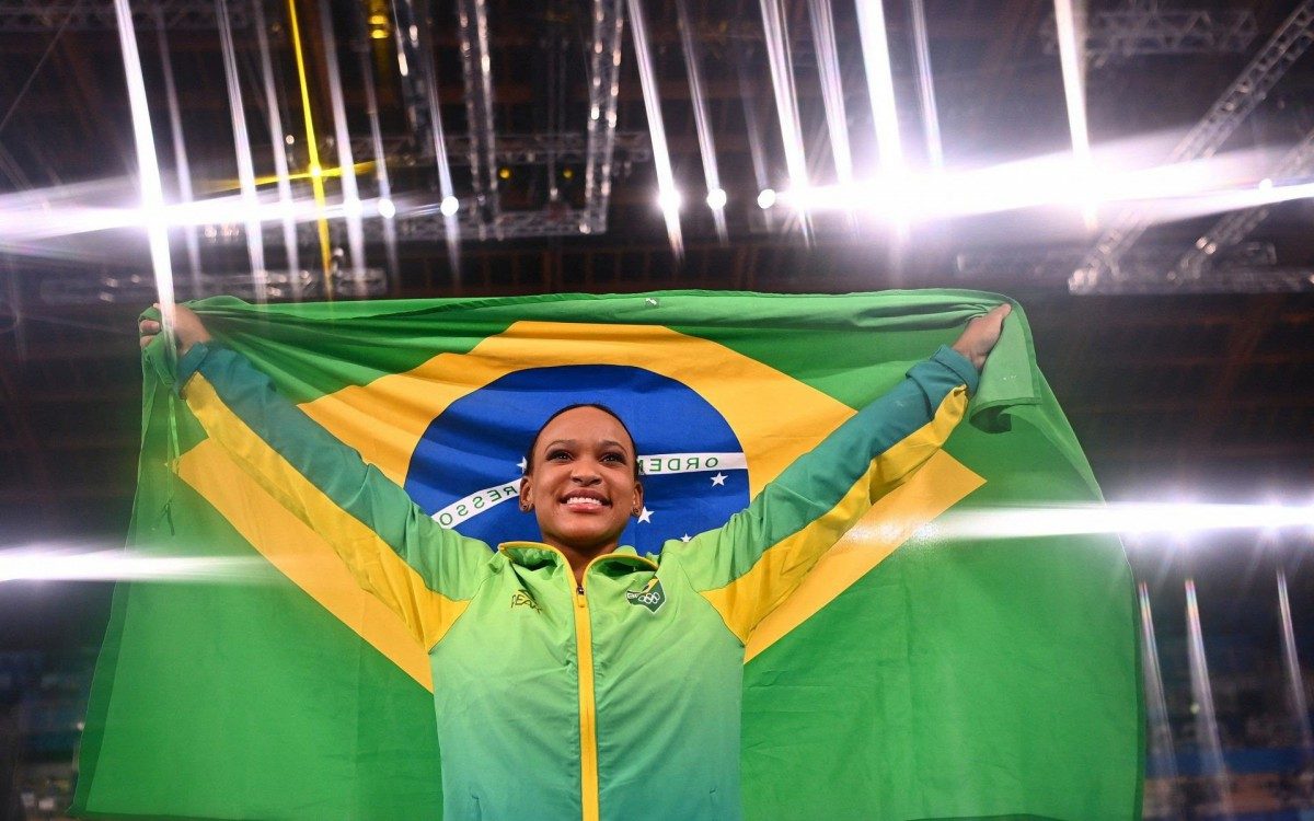 Brazil's Rebeca Andrade celebrates winning gold in the vault event of the artistic gymnastics women's vault final during the Tokyo 2020 Olympic Games at the Ariake Gymnastics Centre in Tokyo on August 1, 2021. (Photo by Loic VENANCE / AFP) - AFP