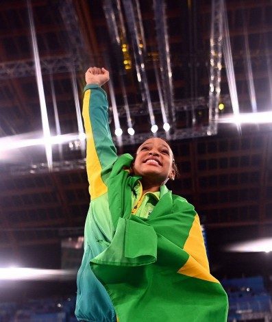 Brazil's Rebeca Andrade celebrates winning gold in the vault event of the artistic gymnastics women's vault final during the Tokyo 2020 Olympic Games at the Ariake Gymnastics Centre in Tokyo on August 1, 2021. (Photo by Loic VENANCE / AFP) - AFP