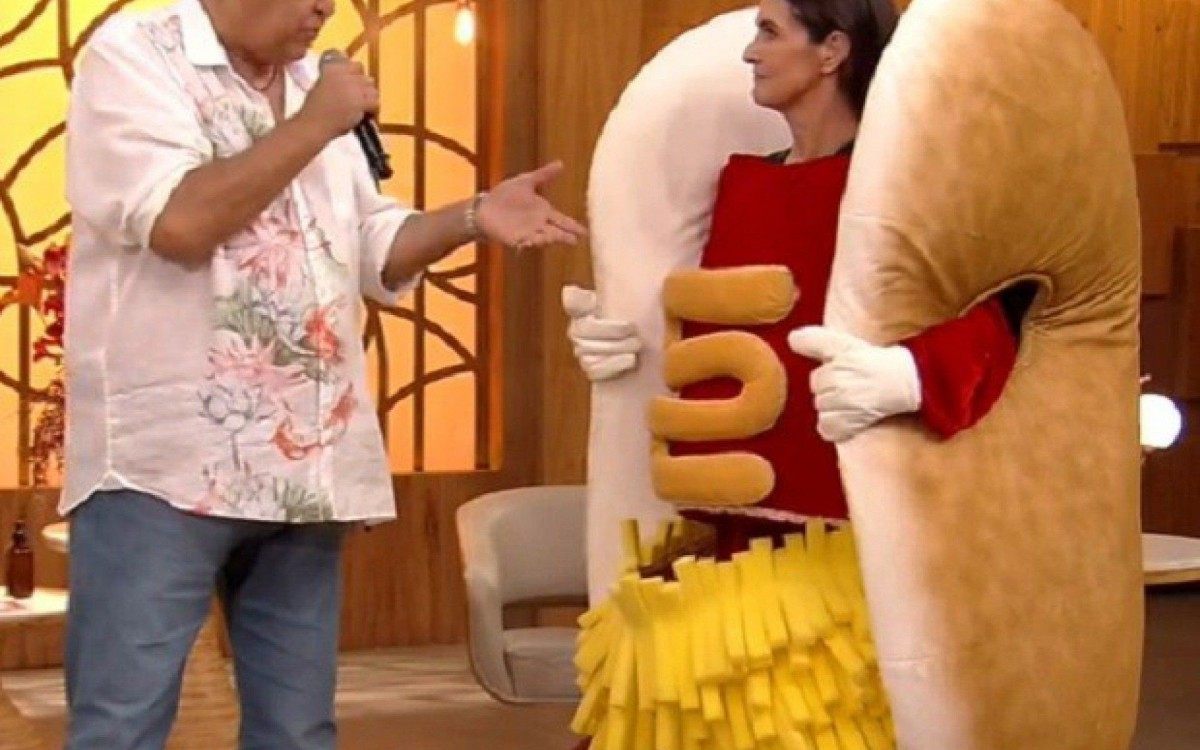 Fátima Bernardes se fantasia de cachorro-quente para encontrar Sidney Magal