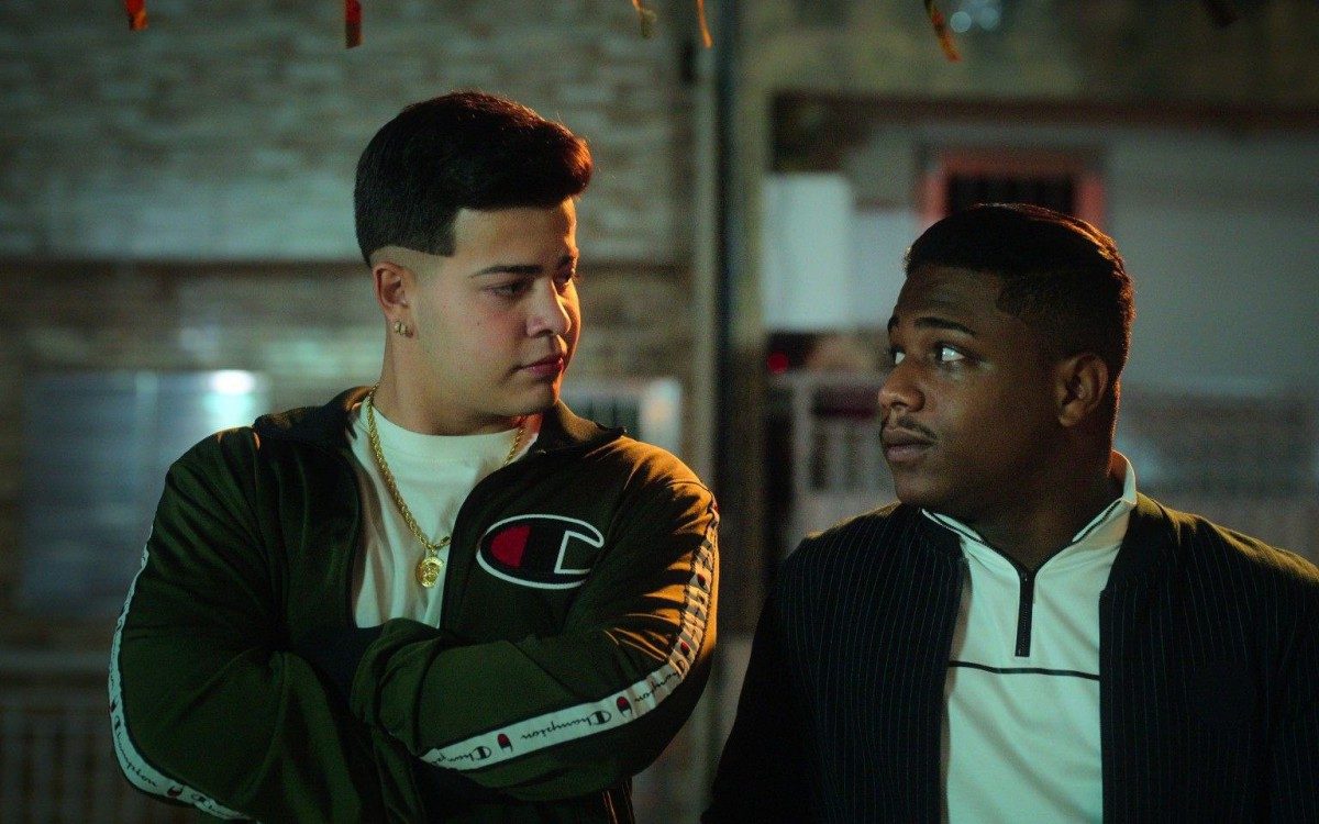 SINTONIA (L to R) JOTTAPE as MC DONI, CHRISTIAN MALHEIROS as NANDO, in episode 1 of SINTONIA. Cr. NETFLIX &copy; 2021