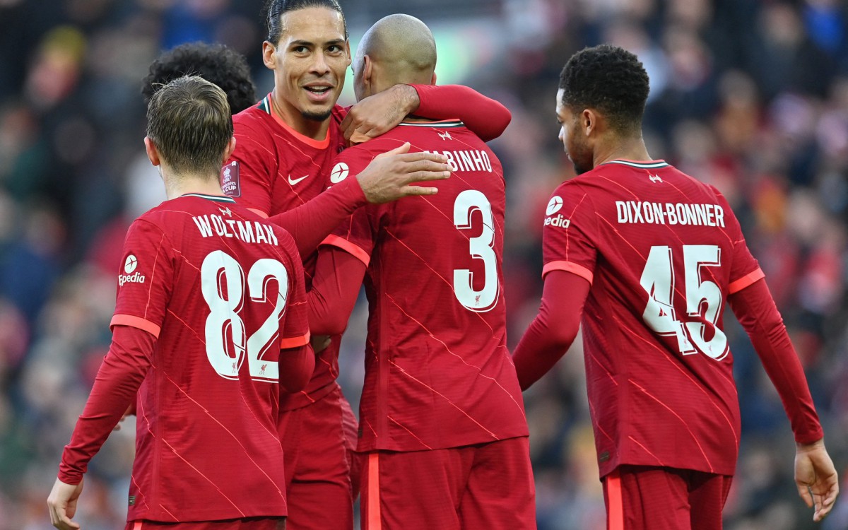 Liverpool's Brazilian midfielder Fabinho (2R) celebrates with Liverpool's Dutch defender Virgil van Dijk (2L) after scoring his team's second goal from the penalty spot during the English FA Cup third round football match between Liverpool and Shrewsbury Town at Anfield in Liverpool, north west England on January 9, 2022