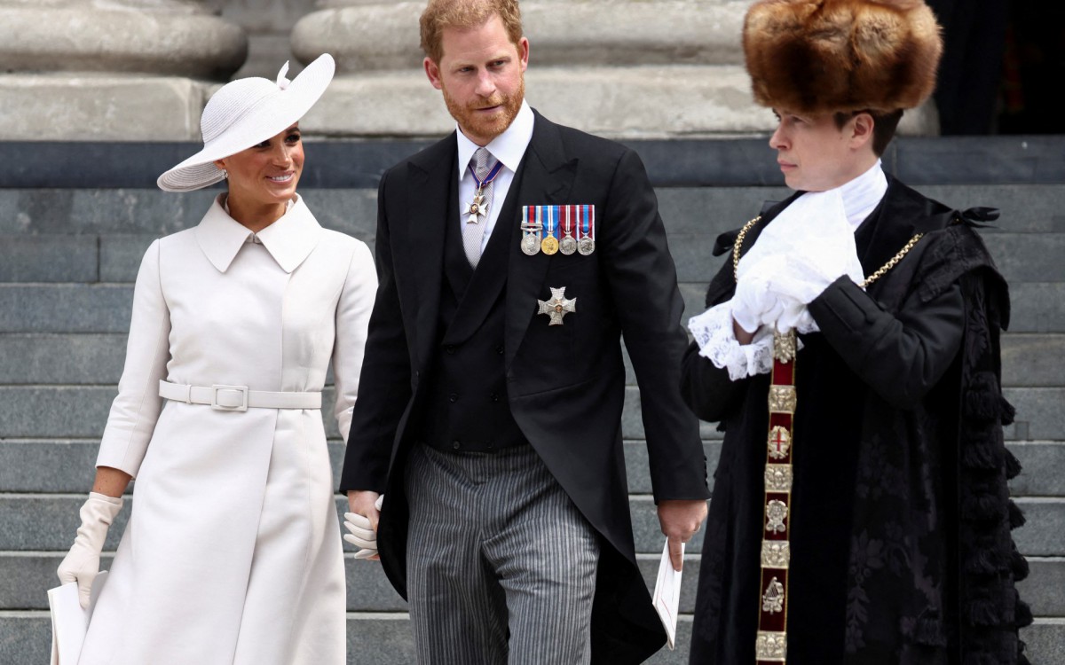 Príncipe Harry e sua esposa Meghan, o duque e a duquesa de Sussex - HENRY NICHOLLS / POOL / AFP