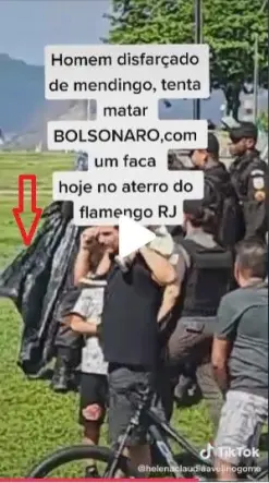 Prints do v&iacute;deo do TikTok mostrando o material pl&aacute;stico preto, que parece ser um saco de lixo, colado ao corpo do homem que est&aacute; sendo levado pela pol&iacute;cia - Reprodu&ccedil;&atilde;o