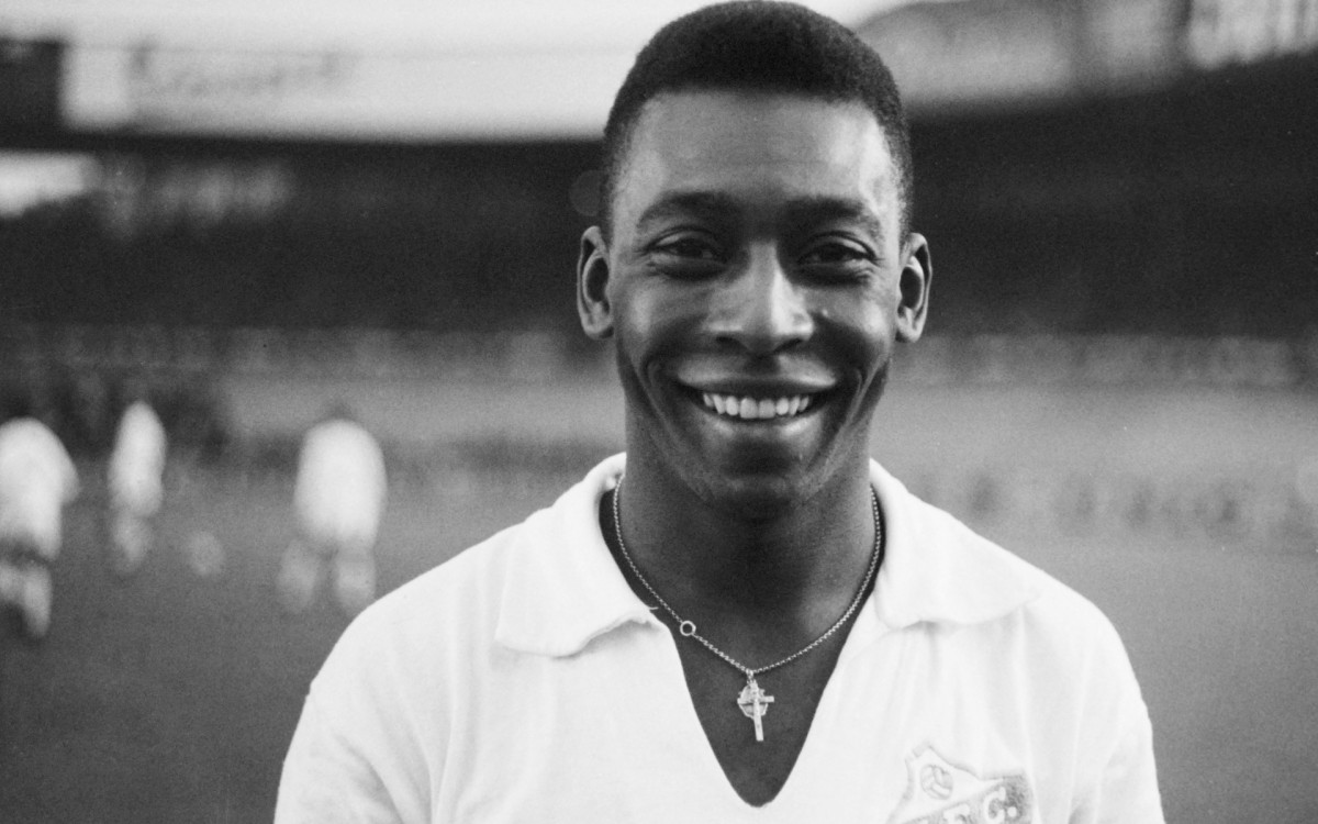 (FILES) In this file photo taken on June 13, 1961 Brazilian striker Pelé, wearing his Santos jersey, smiles before playing a friendly soccer match with his club against the French club of "Racing", in Colombes, in the suburbs of Paris. Brazilian football icon Pele, widely regarded as the greatest player of all time and a three-time World Cup winner who masterminded the 'beautiful game', died on December 29, 2022 at the age of 82, after battling kidney problems and colon cancer. - AFP