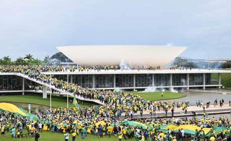 Supporters of Brazilian former President Jair Bolsonaro hold a demonstration at the Esplanada dos Ministerios in Brasilia on January 8, 2023. Brazilian police used tear gas Sunday to repel hundreds of supporters of far-right ex-president Jair Bolsonaro after they stormed onto Congress grounds one week after President Luis Inacio Lula da Silva's inauguration, an AFP photographer witnessed.
 - EVARISTO SA / AFP