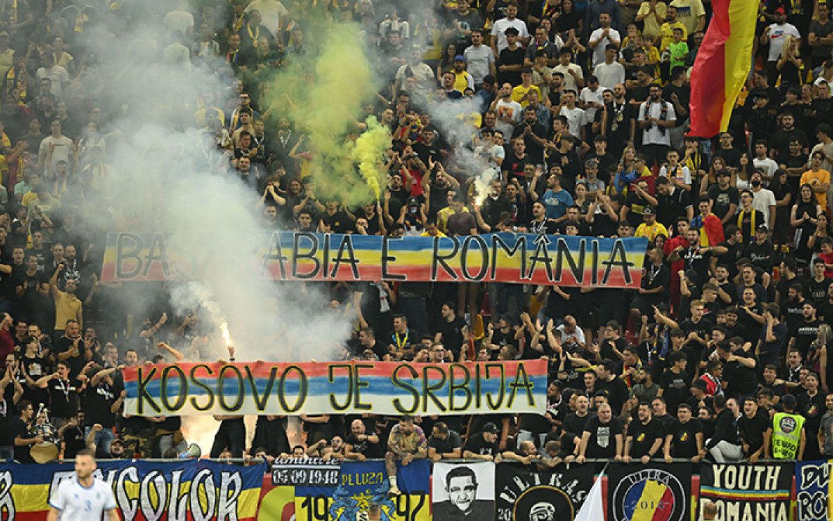 Romanian ultras display a banners reading (in Serbian) "Kosovo is Serbia" and (in Romanian) "Bessarabia is Romania" during the EURO 2024 first round group I qualifying football match between Romania and Kosovo in Bucharest on September 12, 2023. (Photo by Daniel MIHAILESCU / AFP) (Photo by DANIEL MIHAILESCU/AFP via Getty Images)