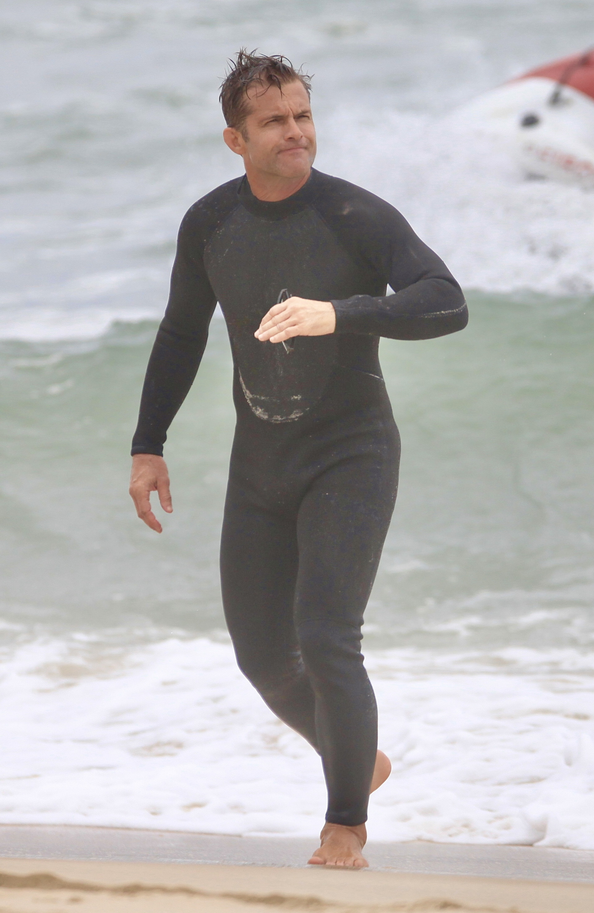  Claudio Heinrich curte dia de praia com a família - Fabrício Pioyani / Agnews