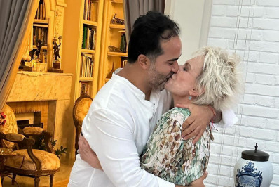 Ana Maria Braga troca beijos com namorado em festa