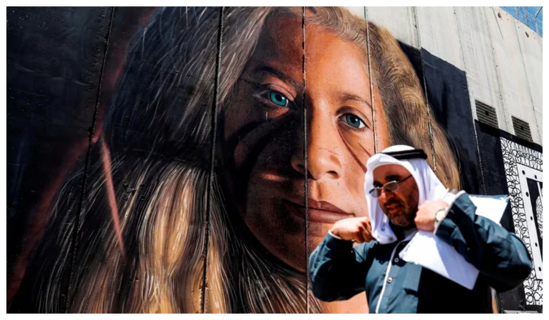 Retrato de Tamimi pintado perto de Bel&eacute;m, no muro de separa&ccedil;&atilde;o constru&iacute;do pelos israelenses na Cisjord&acirc;nia. - AFP
