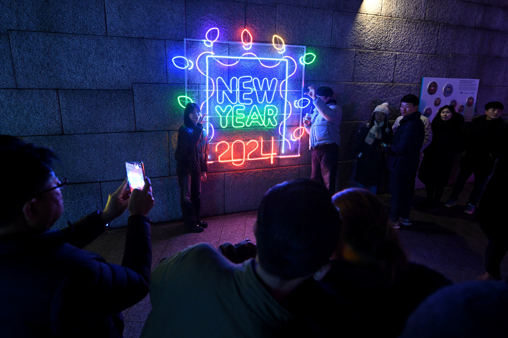 Sul-coreanos durante a celebração de ano novo neste domingo, 31 - Jung Yeon-JE/AFP