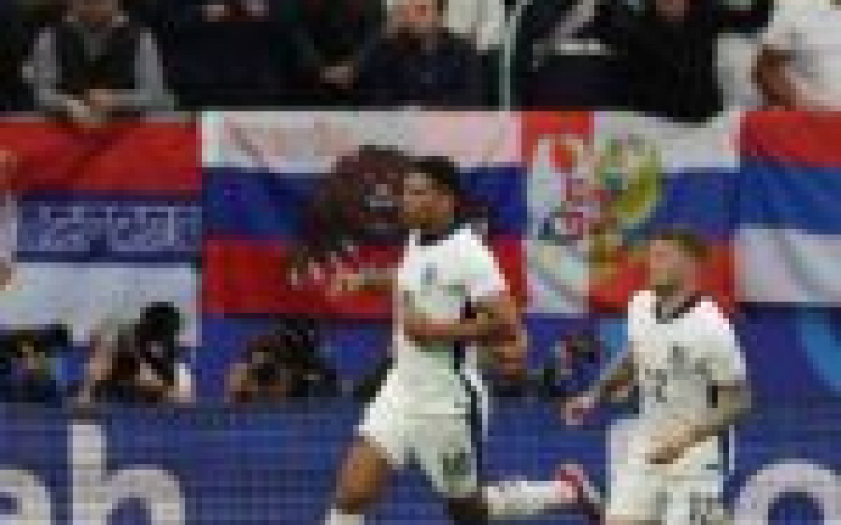 England's midfielder #10 Jude Bellingham celebrates scoring his team's first goal during the UEFA Euro 2024 Group C football match between Serbia and England at the Arena AufSchalke in Gelsenkirchen on June 16, 2024. (Photo by Adrian DENNIS / AFP) (Photo by ADRIAN DENNIS/AFP via Getty Images)