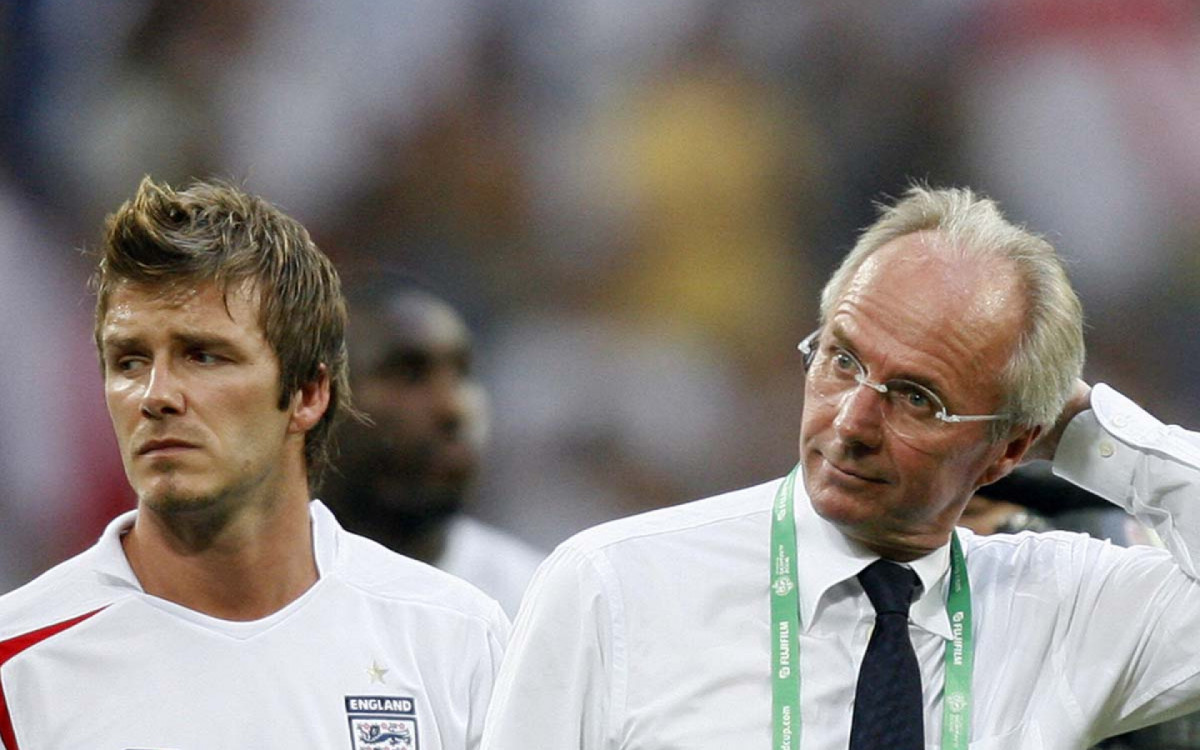 Gelsenkirchen, GERMANY:  English midfielder David Beckham (L) and Swedish head coach of the English team Sven-Goran Eriksson look dejected at the end of the World Cup 2006 quarter final football game England vs. Portugal, 01 July 2006 at Gelsenkirchen stadium. Portugal won 3-1 on penalties. AFP PHOTO / ARIS MESSINIS  (Photo credit should read ARIS MESSINIS/AFP via Getty Images)