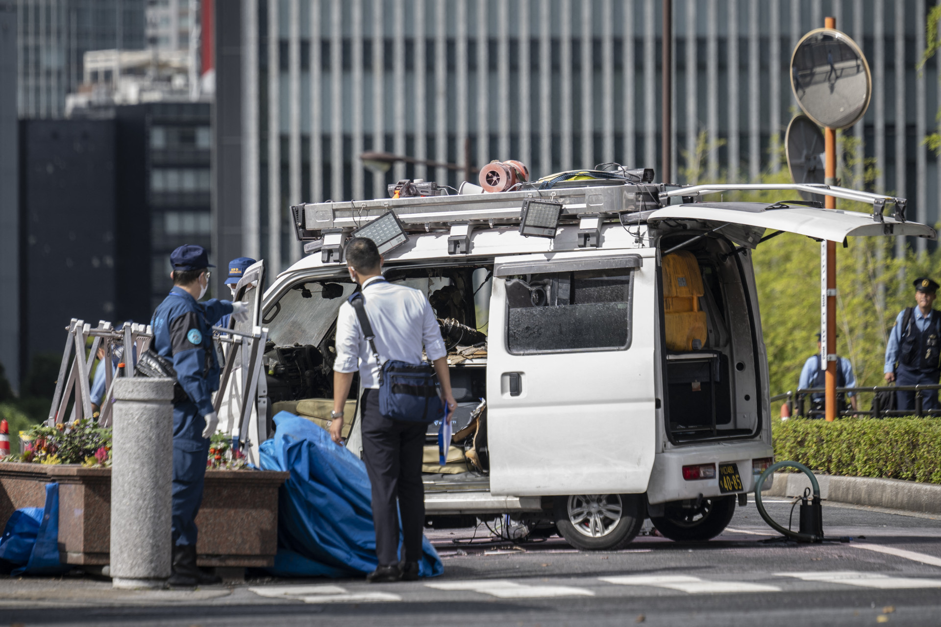 Policiais japoneses realizaram perícia no local do atentado - Yuichi Yamazaki/ AFP