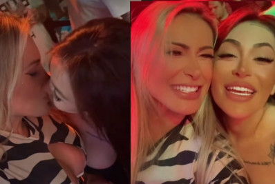 Andressa Urach troca beijos com a namorada em balada